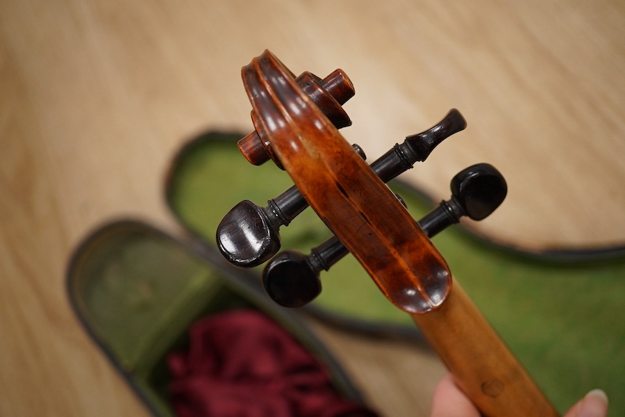 A late 19th century German violin from the Mittenwald region, body length 36cm, in a contemporary case. Condition - fair to good, condition of the case - poor.